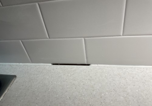 Do you leave a gap between a countertop and backsplash?